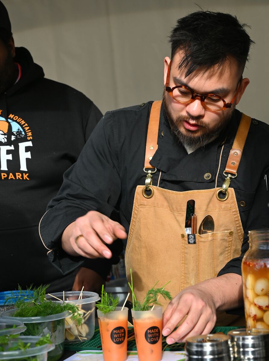 A bartender makes a drink at Made with Love - Banff Food & Cocktail Festival